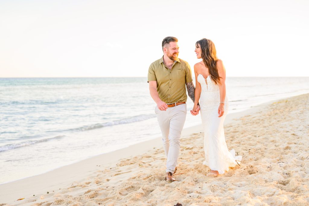 Aiden Laurette Photography | bride and groom walk in beach destination wedding mexico