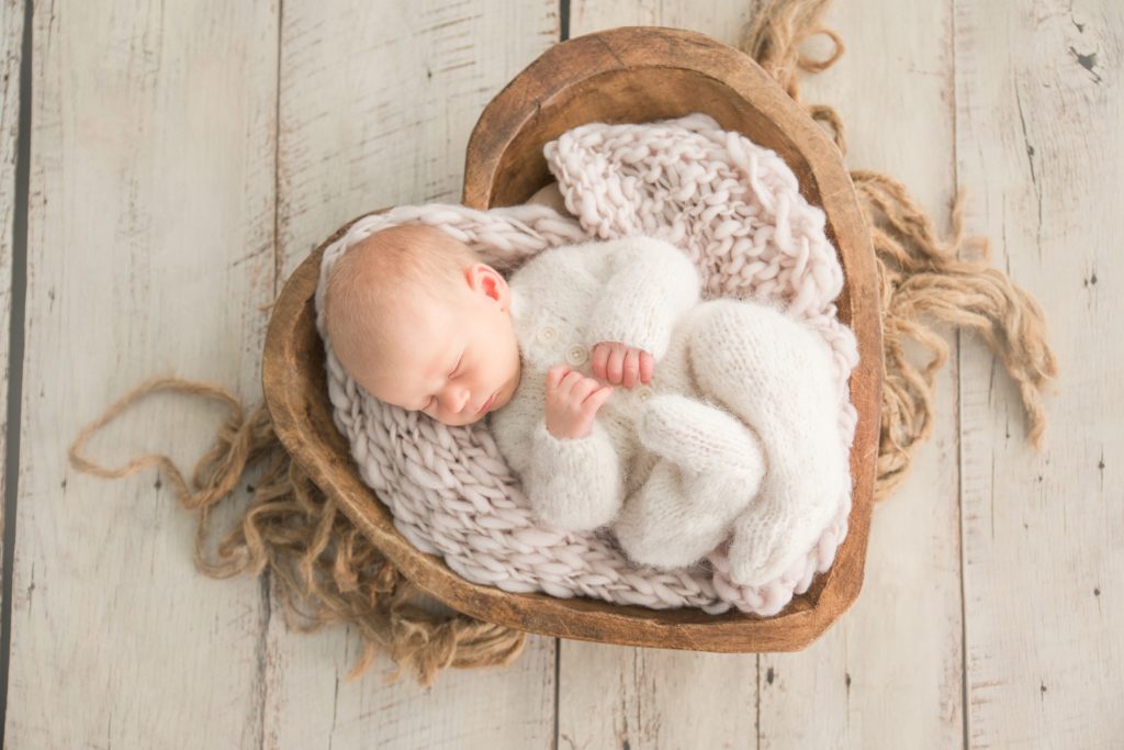 Aiden Laurette Photography | newborn baby in knit outfit sleeping in basket