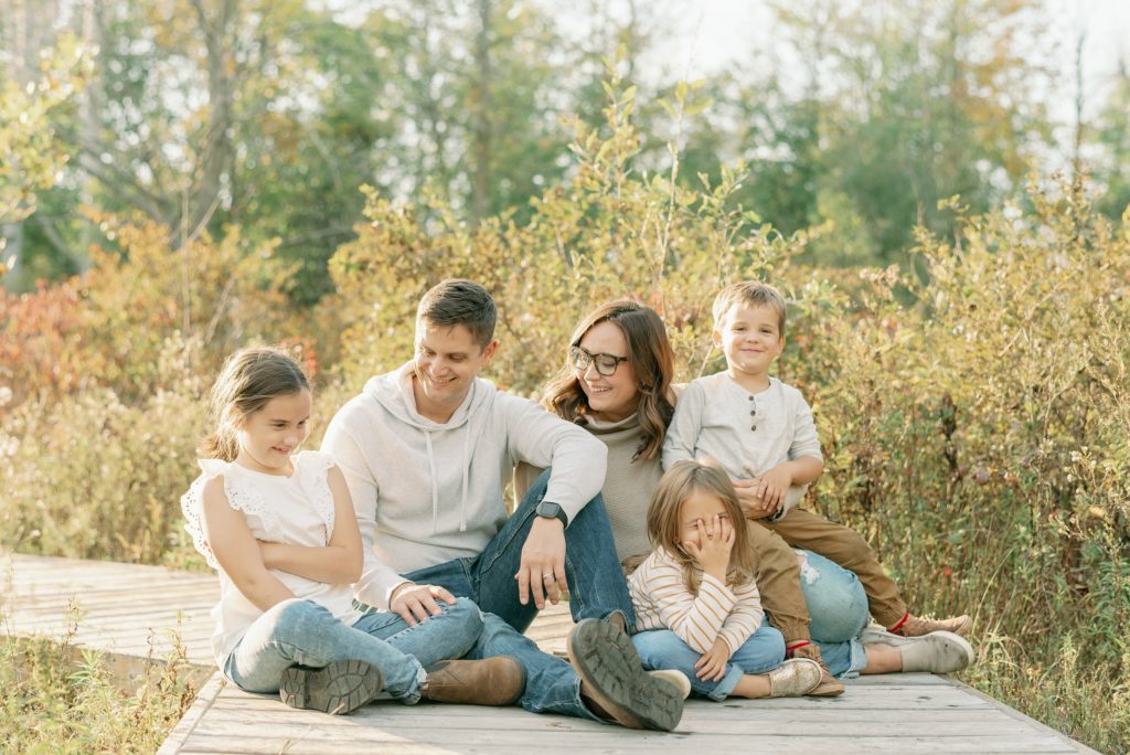 Aiden Laurette Photography | family of five poses in a field