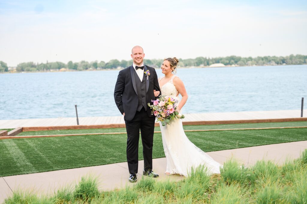 Aiden Laurette Photography | Bride and groom pose in front of St. Clair river