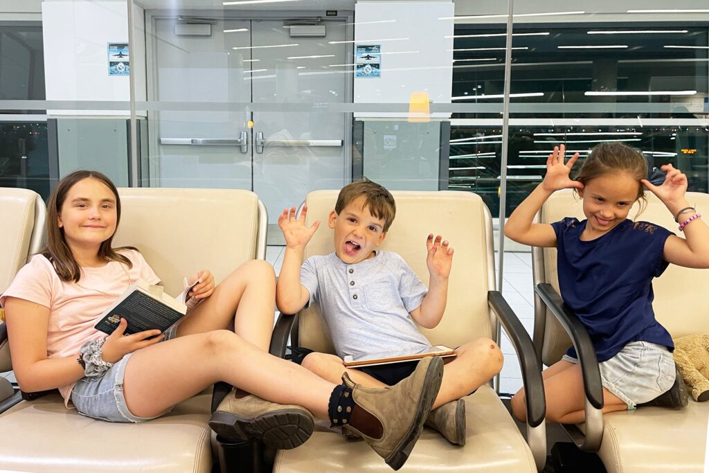 Aiden Laurette Photography | kids in airport waiting for flight