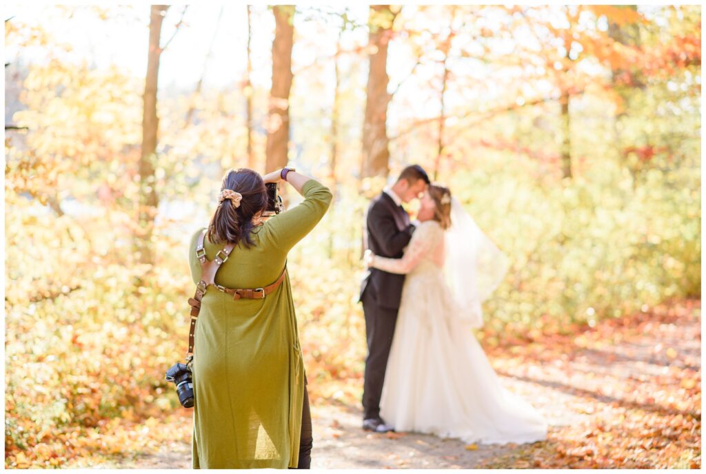 Photographer photographing bride and groom