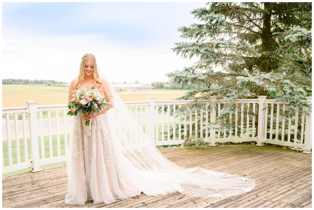 Aiden Laurette Photography | bride poses on wedding day