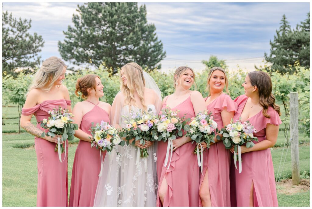 Aiden Laurette Photography | bride and groom pose with wedding party