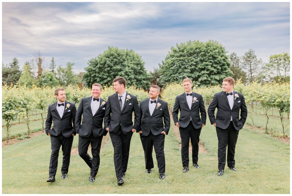 Aiden Laurette Photography | bride and groom pose with wedding party