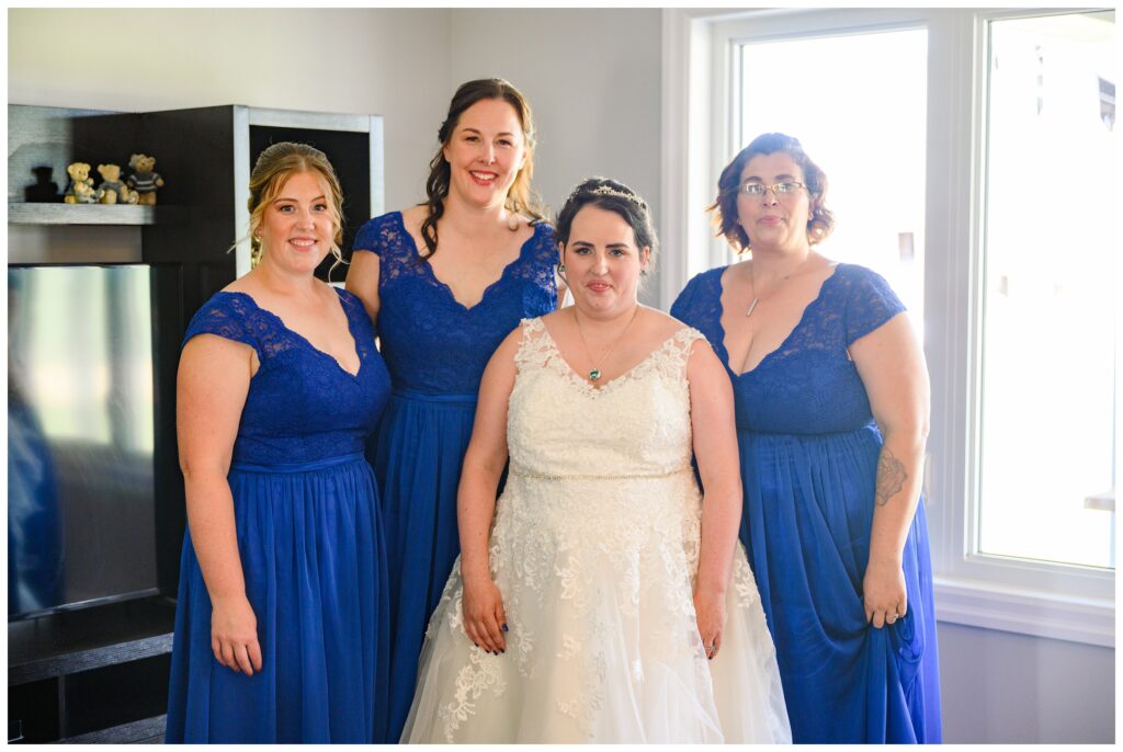 Aiden Laurette Photography | Bride poses with bridesmaids