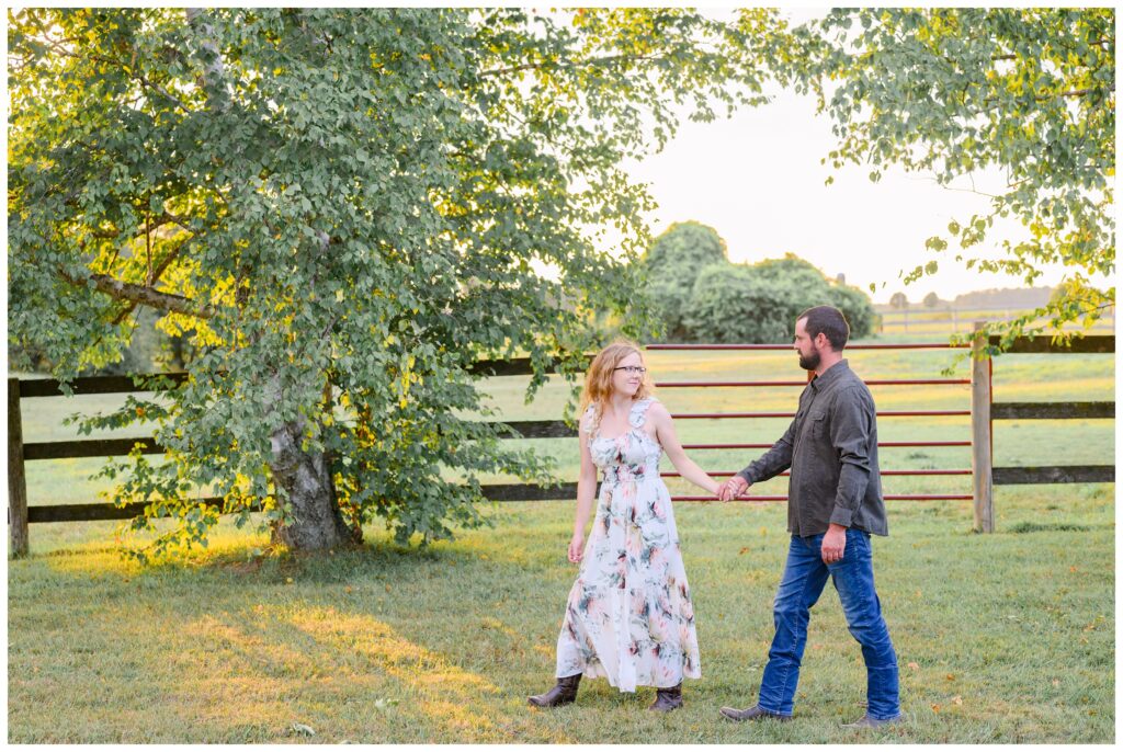 Aiden Laurette Photography | couple walks in pasture