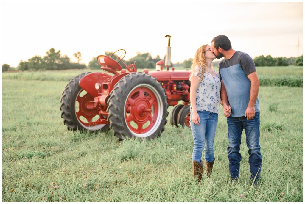 Aiden Laurette Photography | couple poses in front of antique tractor