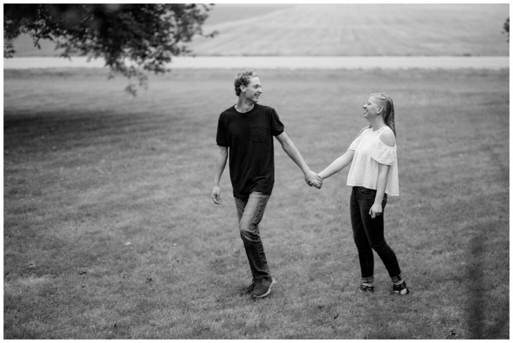 Aiden Laurette Photography | couple poses in field