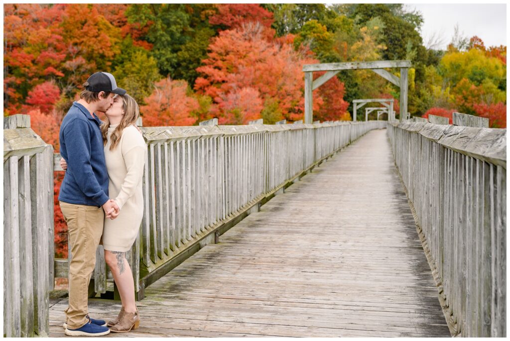 Aiden Laurette Photography | couple poses on bridge